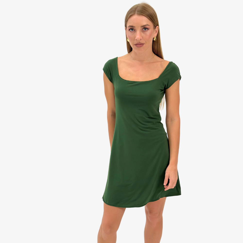 Tcheriz' Gigi mini dress Woman wearing a green dress on a white background