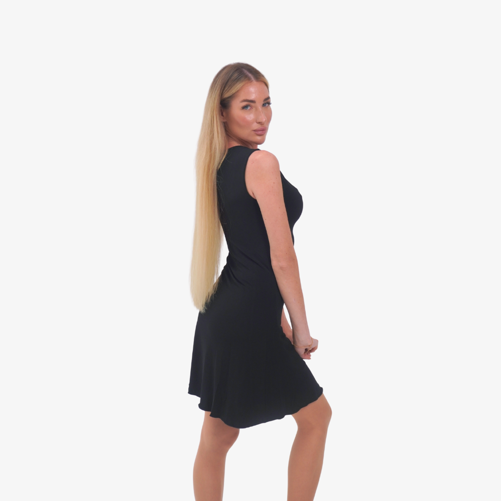 Carmen mini dress Woman wearing a black dress on a white background