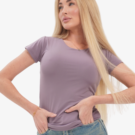 Olivia t-shirt Woman wearing a purple t-shirt and blue jeans on a white background