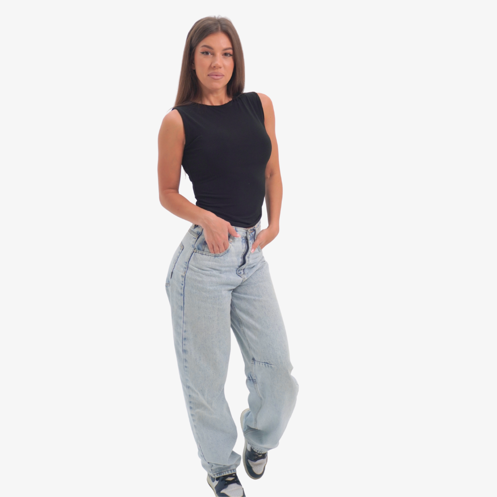 Emma - straight neckline top Woman wearing a black sleeveless top and light blue jeans on a white background