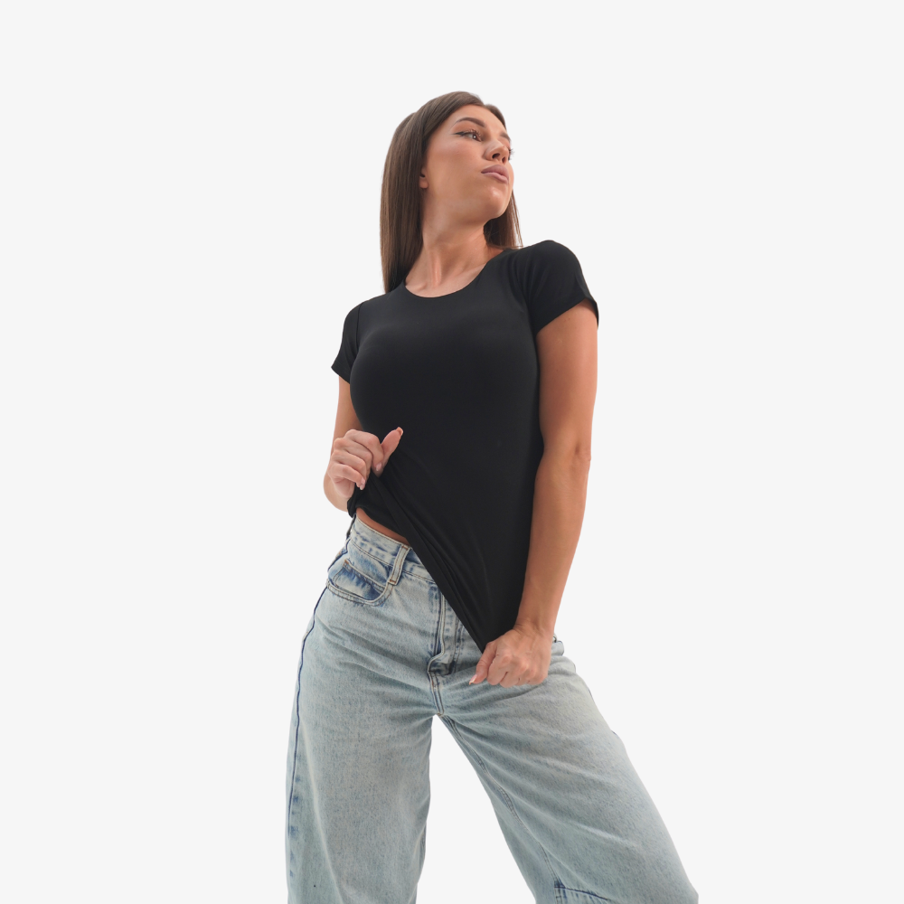 Olivia t-shirt Woman wearing a black t-shirt and light blue jeans on a white background