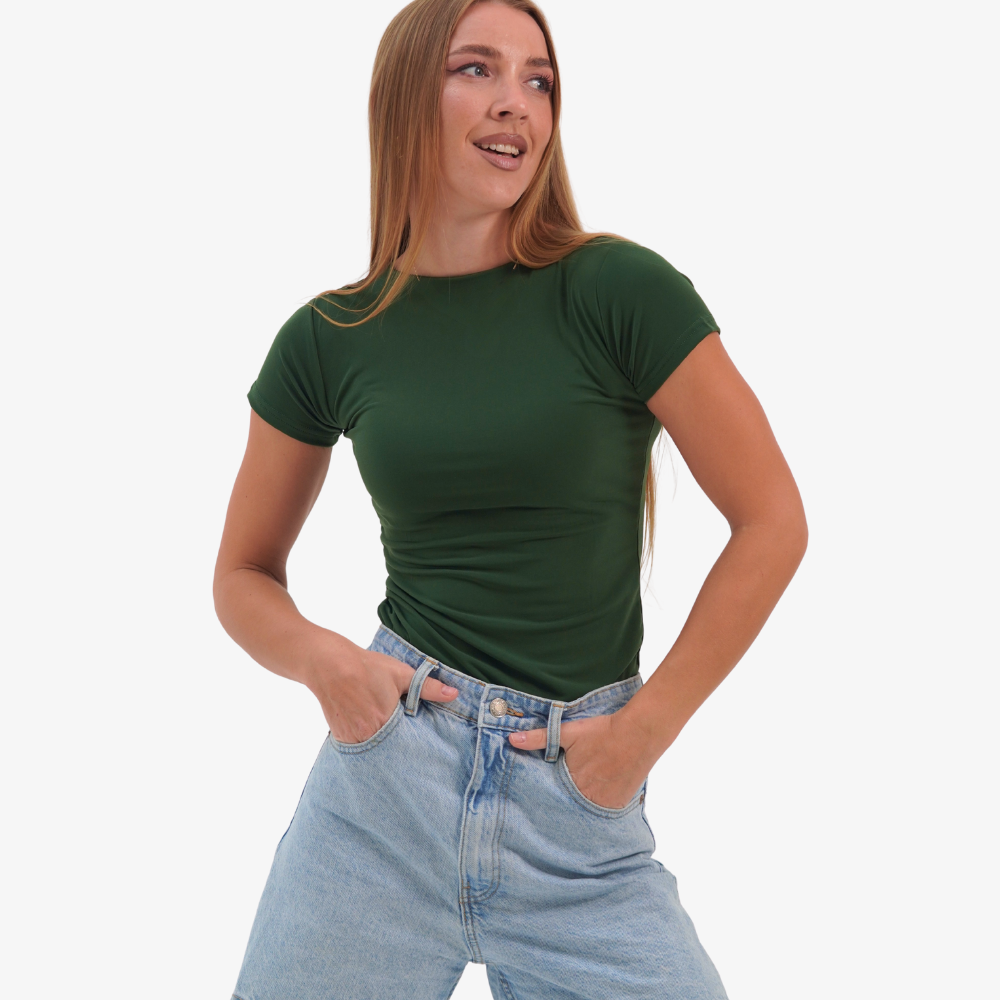 Olivia t-shirt Woman wearing a green t-shirt and blue jeans on a white background