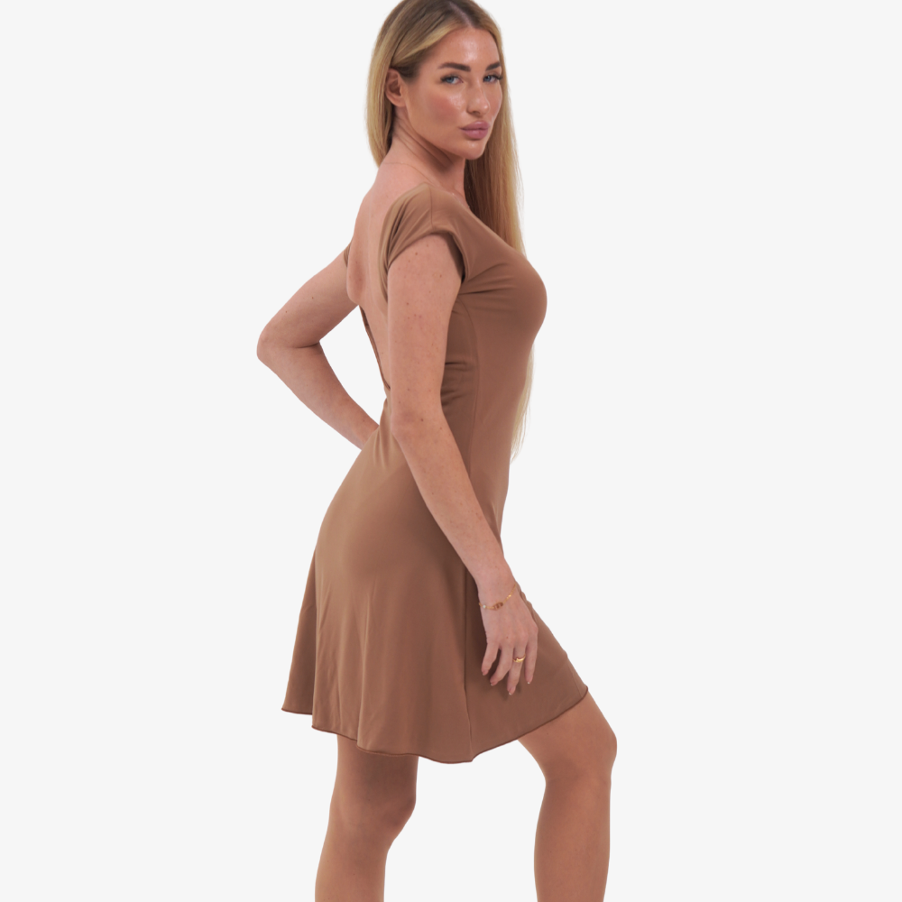 Tcheriz' Gigi mini dress Woman wearing a brown dress on a white background