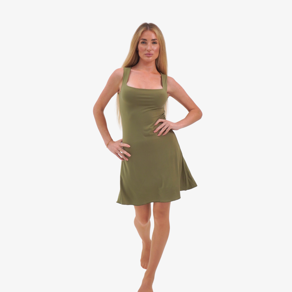 Carmen mini dress Woman wearing a olive green dress on a white background